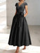 Black satin tea length dress with a tie bow
