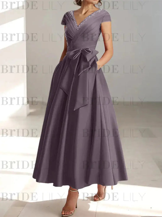 Dusk satin mother of the bride tea length dress with bow and pockets