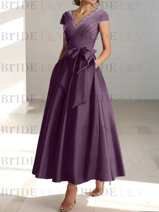 Grape satin mother of the bride tea length dress with bow and pockets