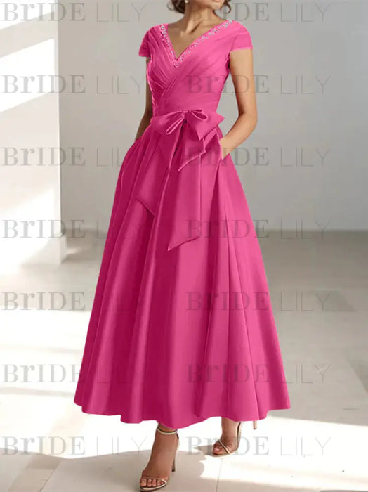 Hot pink satin tea length dress with a tie bow