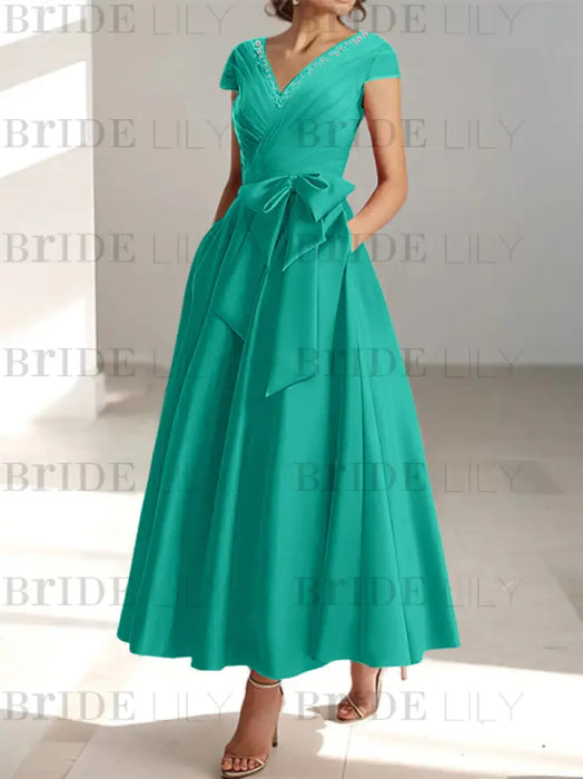 Jade satin mother of the bride tea length dress with bow and pockets