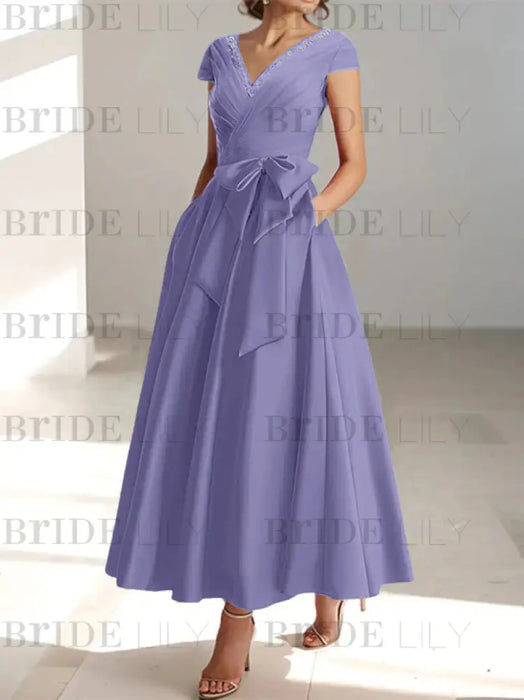Lavender satin mother of the bride tea length dress with bow and pockets
