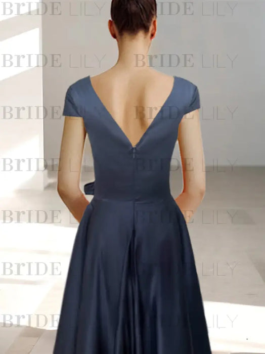 Back of the navy satin dress with a deep V back