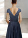 Back of the navy satin dress with a deep V back