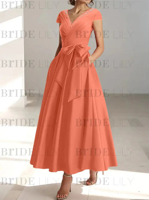 Papaya satin mother of the bride tea length dress with bow and pockets