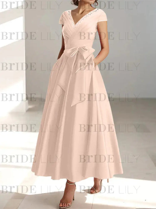 Pearl Pink satin mother of the bride tea length dress with bow and pockets