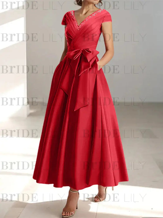 Red satin mother of the bride tea length dress with bow and pockets