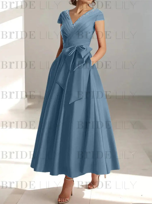 Stormy satin mother of the bride tea length dress with bow and pockets