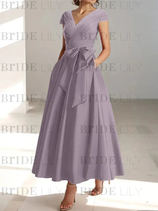 Wisteria satin mother of the bride tea length dress with bow and pockets