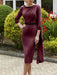 Burgundy crepe dress with a beaded neckline and cape panel