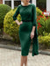 Emerald green crepe dress with a beaded neckline and panel