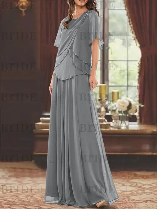 Grey beaded chiffon overtop with a matching floor-length skirt