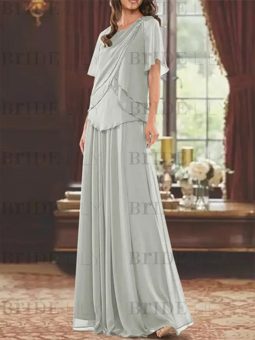Mist green beaded chiffon overtop with a matching skirt