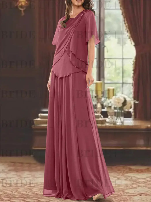 Rose pink beaded chiffon overtop with a matching skirt