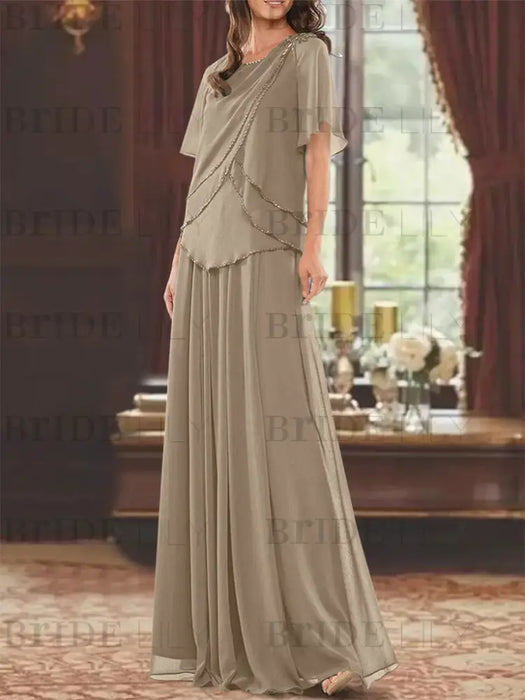 Taupe beaded chiffon overtop with a matching floor-length skirt