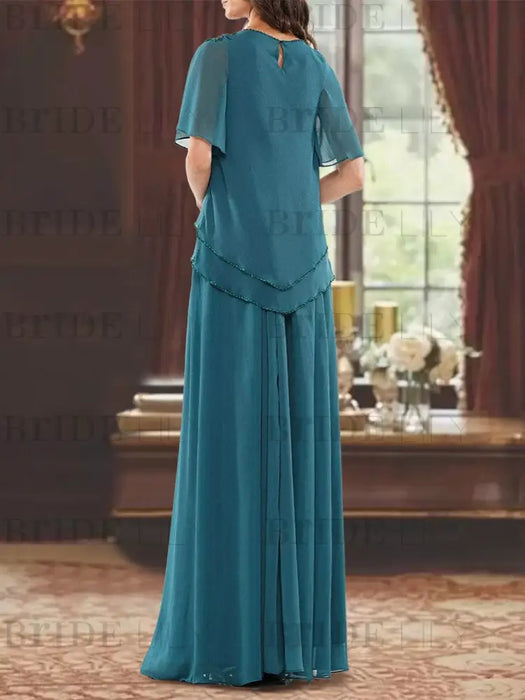 Back view of the teal beaded chiffon two-piece outfit