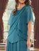 Close-up of the beaded scalloped tiers on the teal chiffon top