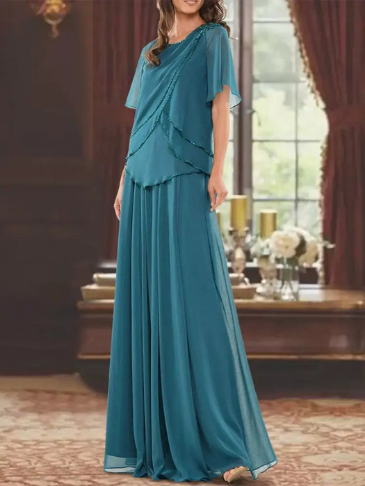 Teal beaded chiffon overtop with a matching floor-length skirt