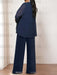 Back view of the navy chiffon tunic, jacket and trousers