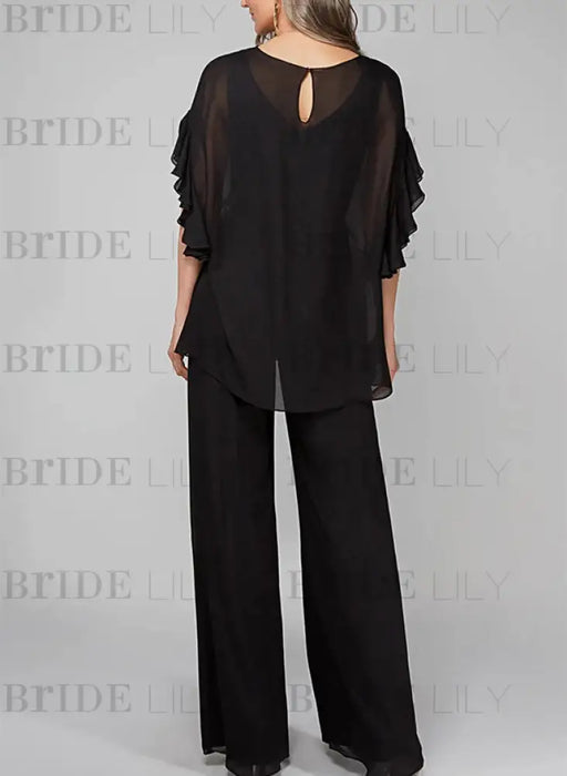 Back view of black chiffon cape overlay pantsuit