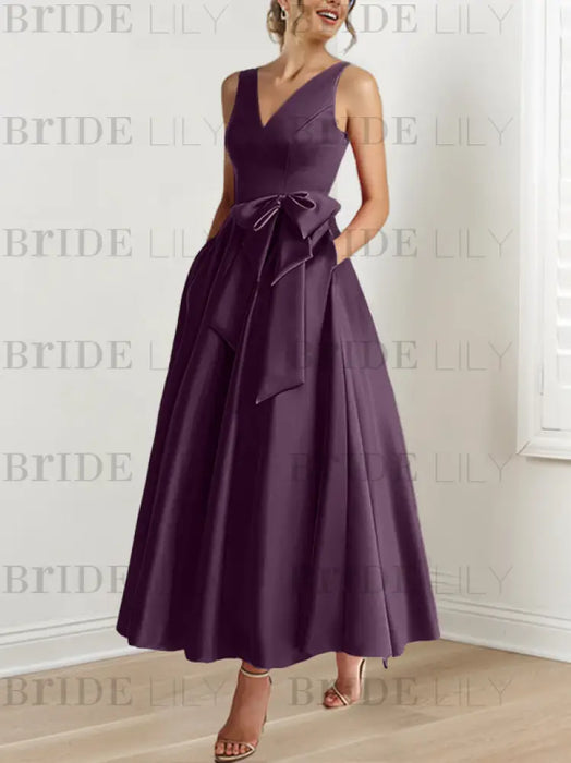 Aubergine satin ankle length dress with a bow sash
