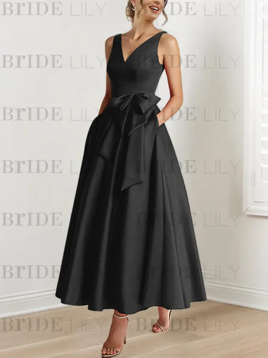 Black satin ankle length dress with a bow sash