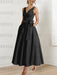 Black satin ankle length dress with a bow sash