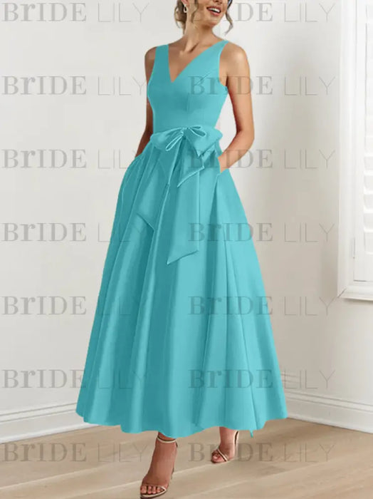 Blue satin mother of the bride ankle dress with bow sash and pockets
