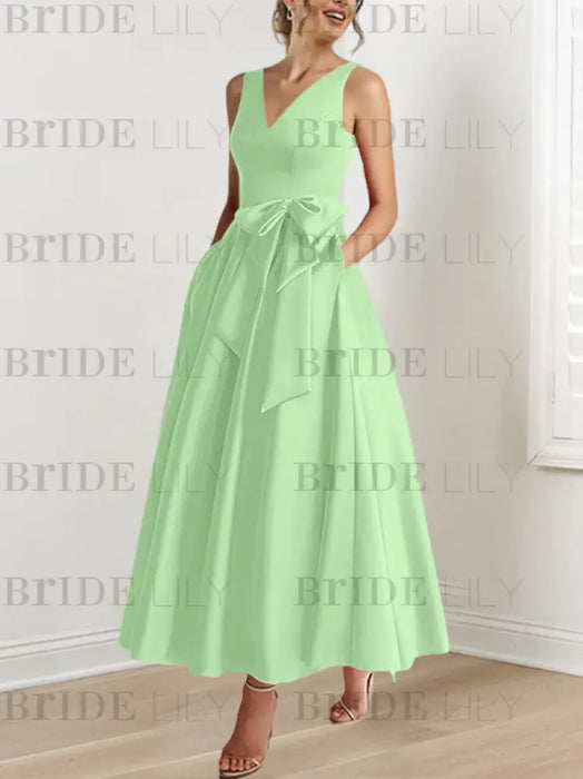 Celadon satin mother of the bride ankle dress with bow sash and pockets
