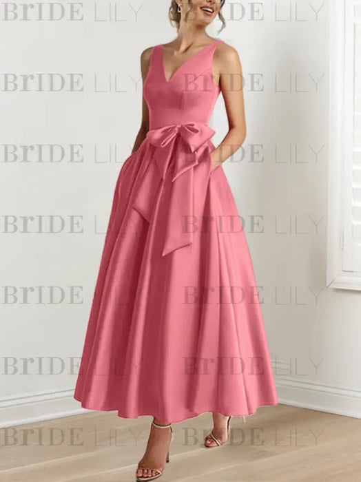 Coral satin ankle length dress with a bow sash