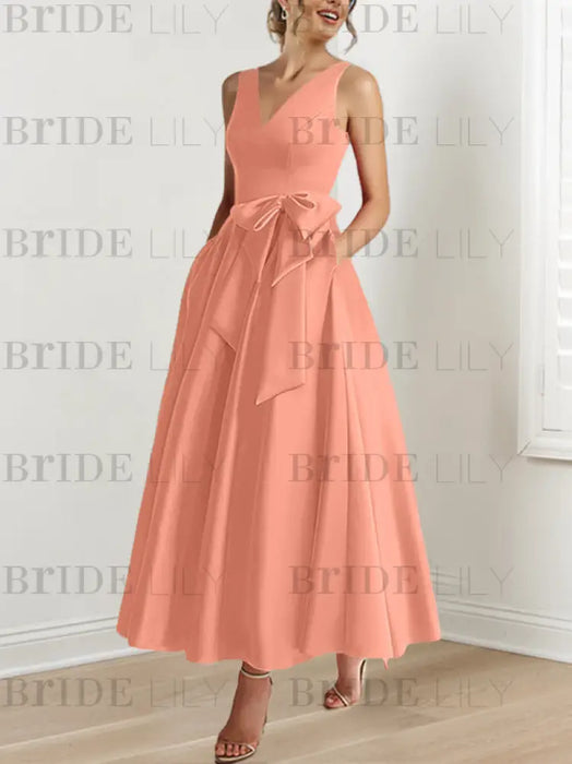Coral satin mother of the bride ankle dress with bow sash and pockets