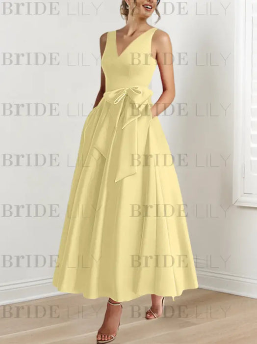 Daffodil satin mother of the bride ankle dress with bow sash and pockets