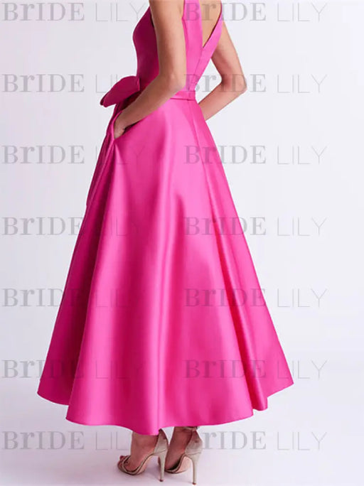 Back of the fuchsia satin dress with a V back