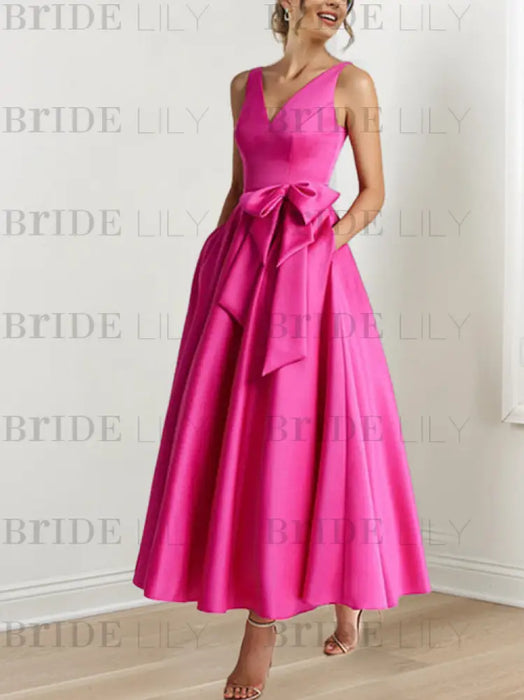 Fuchsia satin ankle length dress with a bow sash