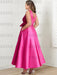 Full length back view of the fuchsia satin dress