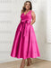 Fuchsia satin bow dress worn by a curve model