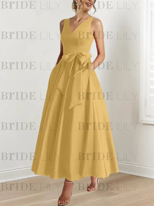 Gold satin mother of the bride ankle dress with bow sash and pockets