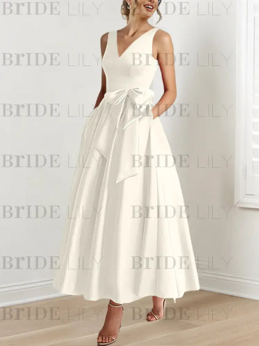 Ivory satin mother of the bride ankle dress with bow sash and pockets