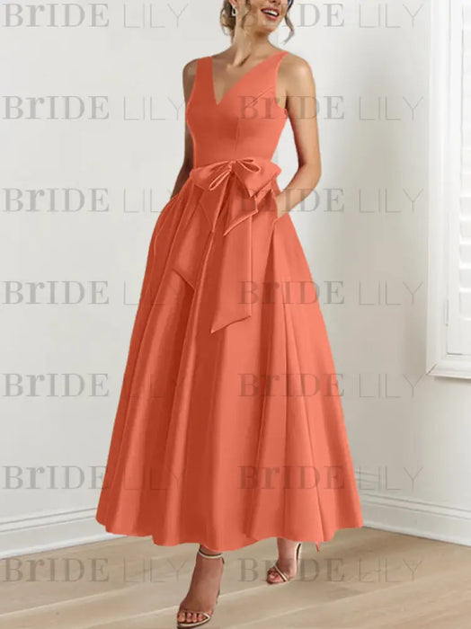 Papaya satin mother of the bride ankle dress with bow sash and pockets