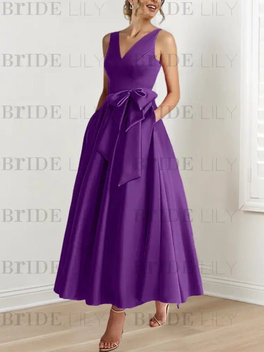 Plum satin mother of the bride ankle dress with bow sash and pockets