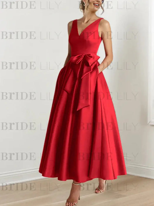 Red satin mother of the bride ankle dress with bow sash and pockets