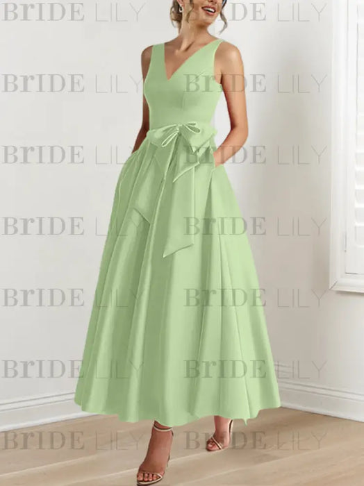 Sage satin mother of the bride ankle dress with bow sash and pockets