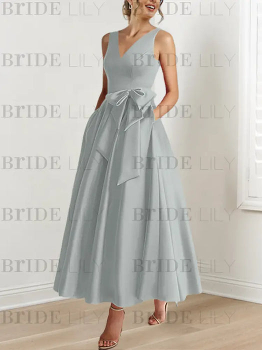 Silver satin mother of the bride ankle dress with bow sash and pockets