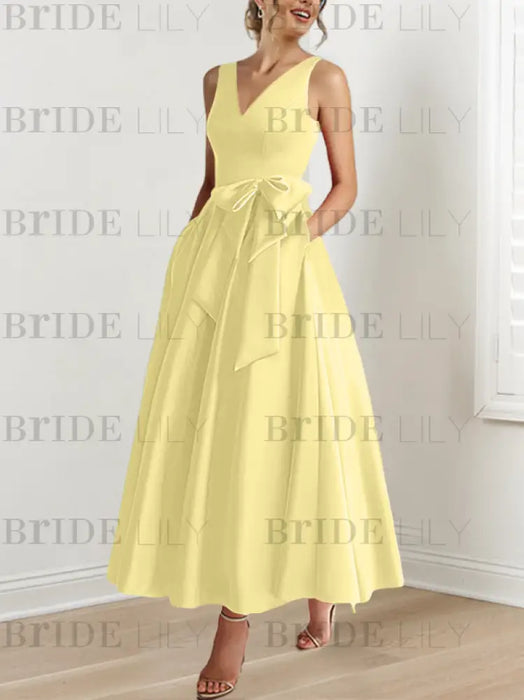 Yellow satin mother of the bride ankle dress with bow sash and pockets