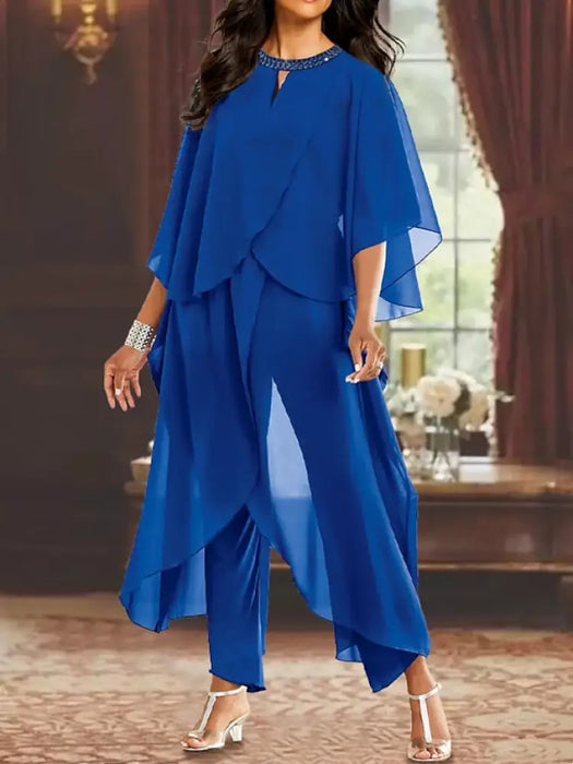 Royal blue chiffon pantsuit with a cape overlay and beaded neckline