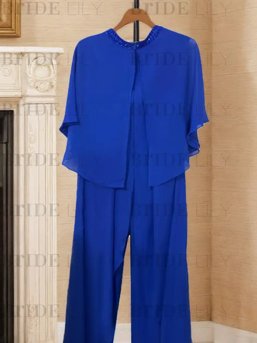 Royal blue chiffon cape top and wide leg trousers on a hanger