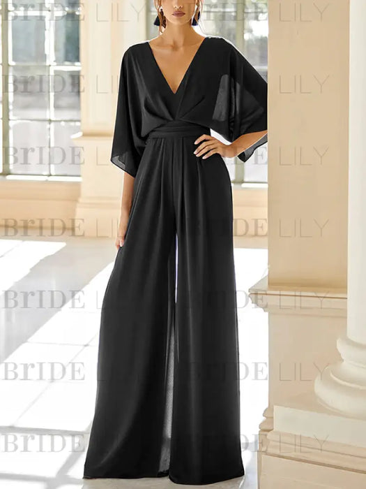 Chiffon jumpsuit with kimono sleeves and pockets in black