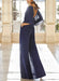 Back view of the navy chiffon jumpsuit with an open tie back