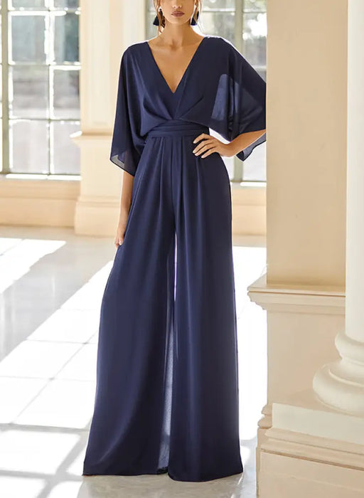 Navy chiffon jumpsuit with kimono sleeves and a ruched waist