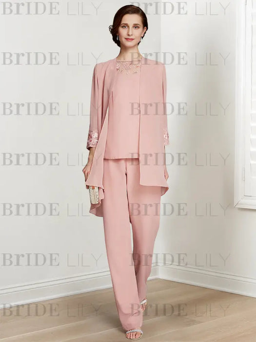 Blush pink chiffon pantsuit worn with the long jacket open